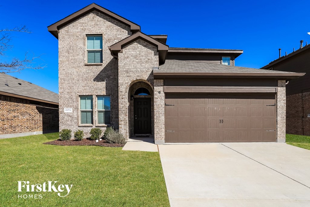 A house with a garage door numbered 03.