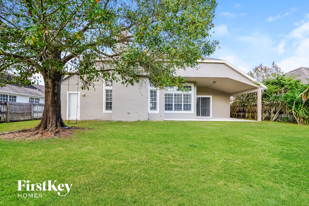 A house with a tree in front of it.