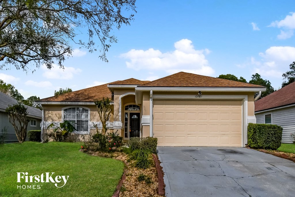 a house with a driveway and a garage door