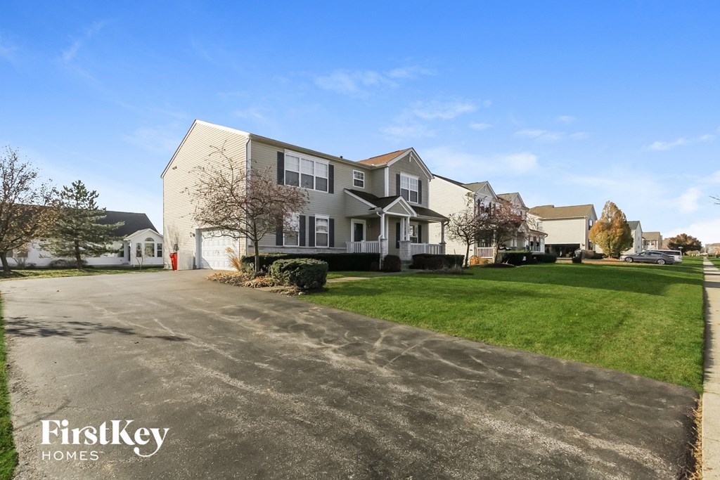 a large house with a driveway in front of it