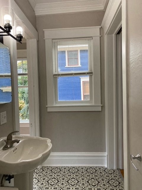 a bathroom with a sink and a window