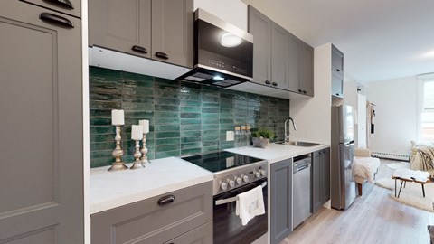 a kitchen with a stove and a tv