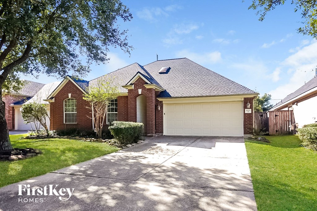 A house with a garage is for sale by FirstKey Homes.