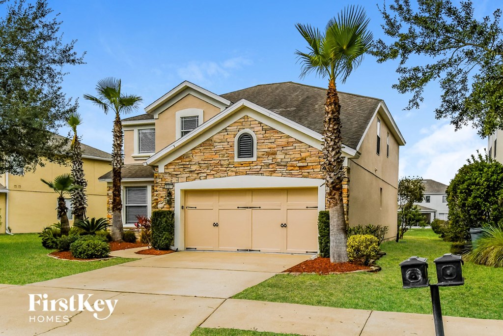 A house with a garage is for sale by FirstKey Homes.