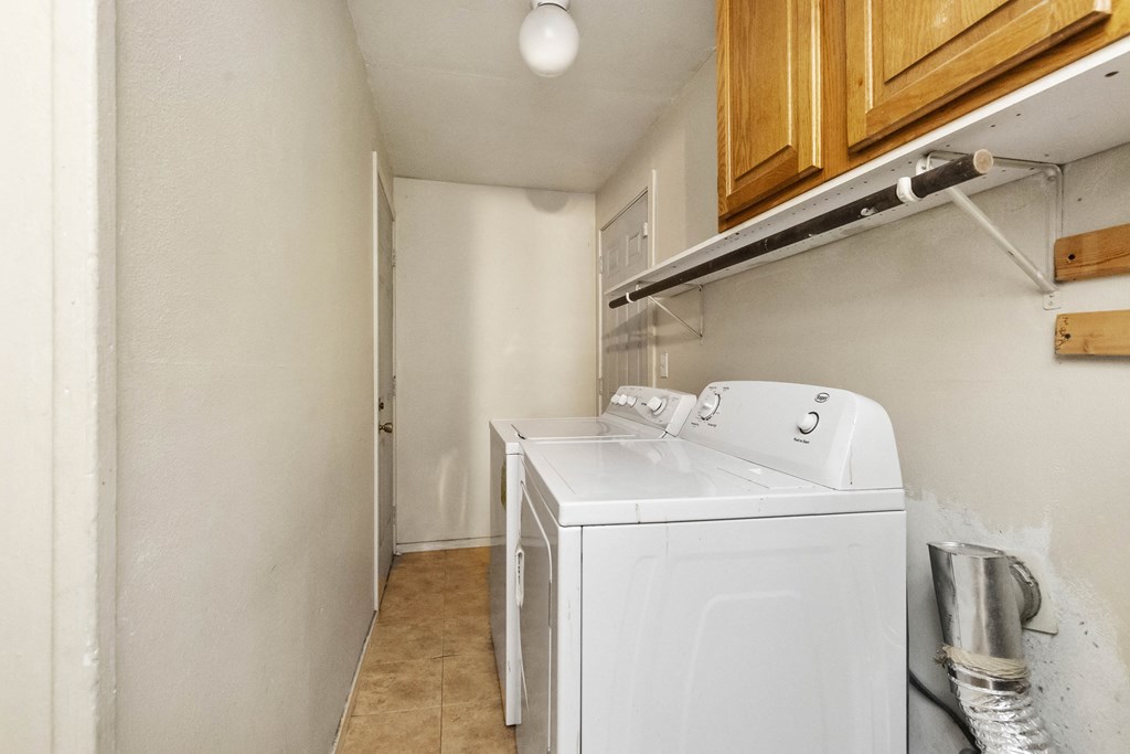 a small laundry room with a washer and dryer in it