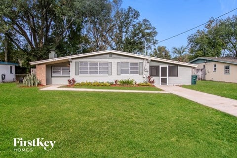 A house with a lawn in front of it.