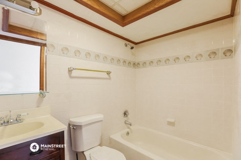 a bathroom with a sink toilet and a bath tub