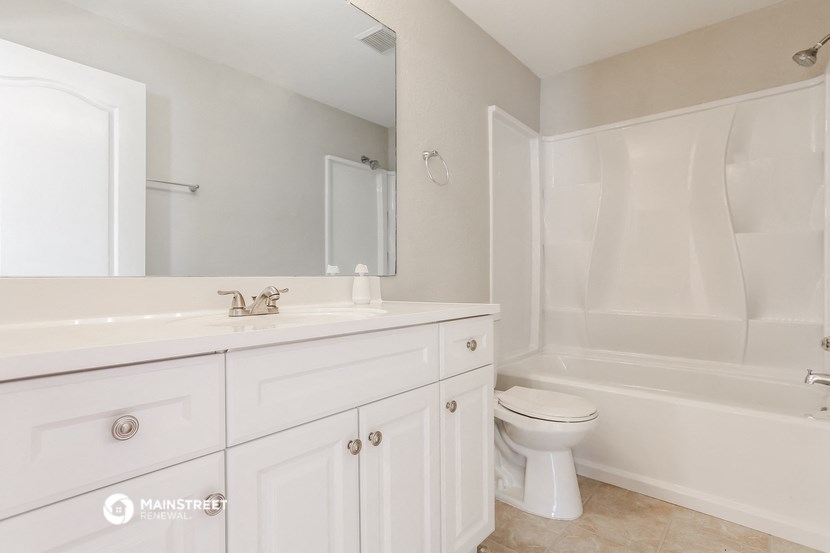 a bathroom with a sink toilet and a shower