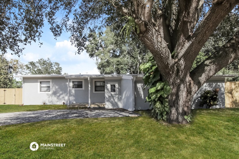 a house with a tree in front of it