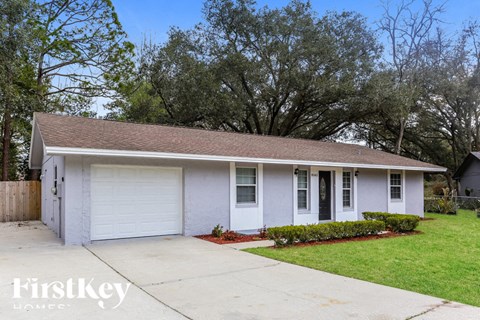 A two-car garage with a white door and a brown roof.