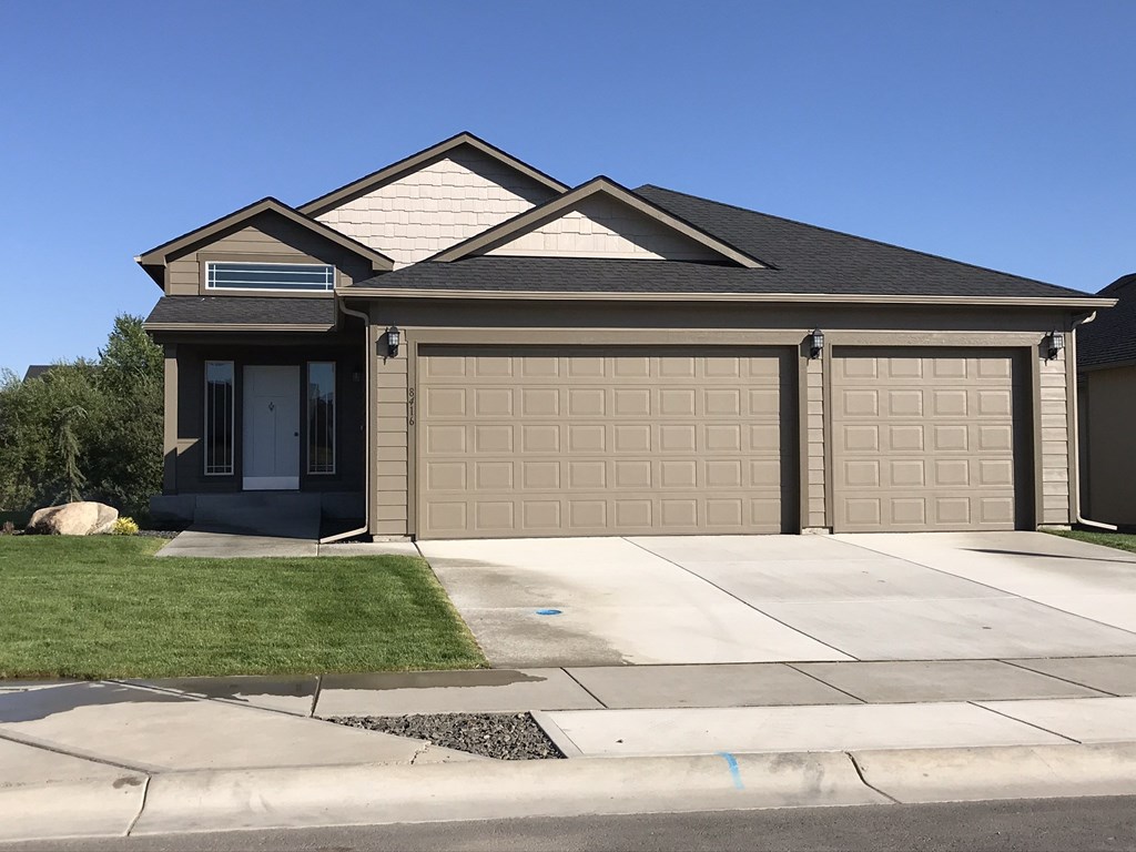 a house with a driveway and a garage door
