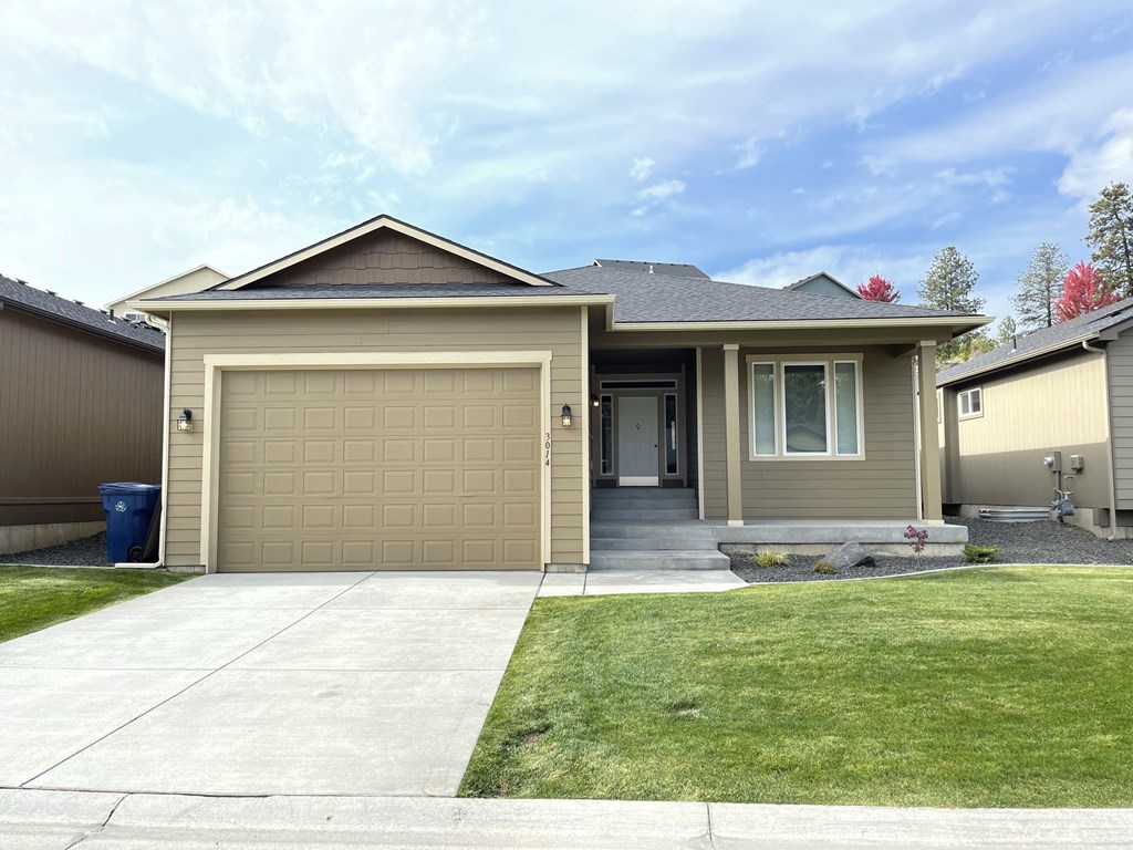 a house with a driveway and a garage door