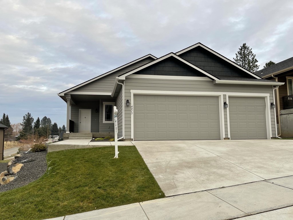 a house with a driveway and a garage door