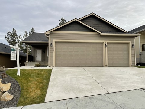 a house with a driveway and a garage door