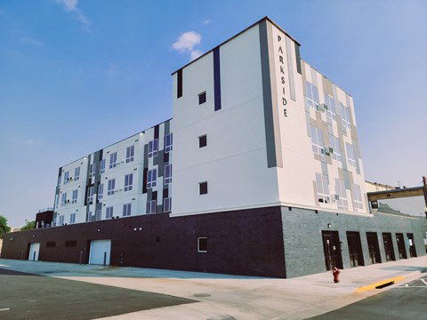 A modern building with the words "PARKSIDE" on the side.