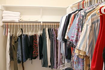 walk-in closet full of clothes