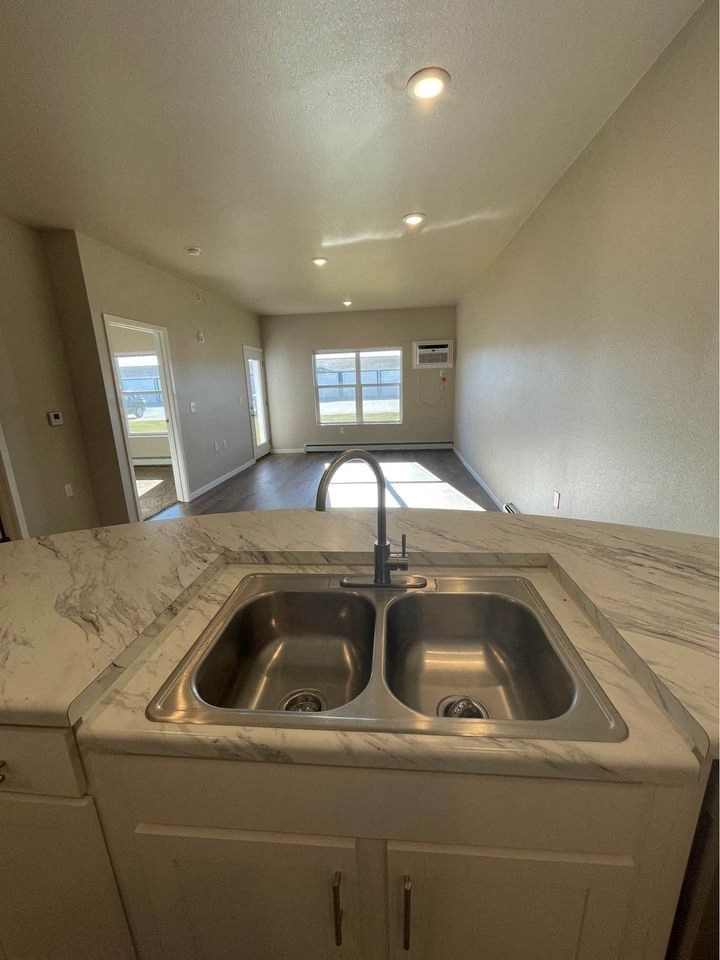 a kitchen with a sink and a counter top
