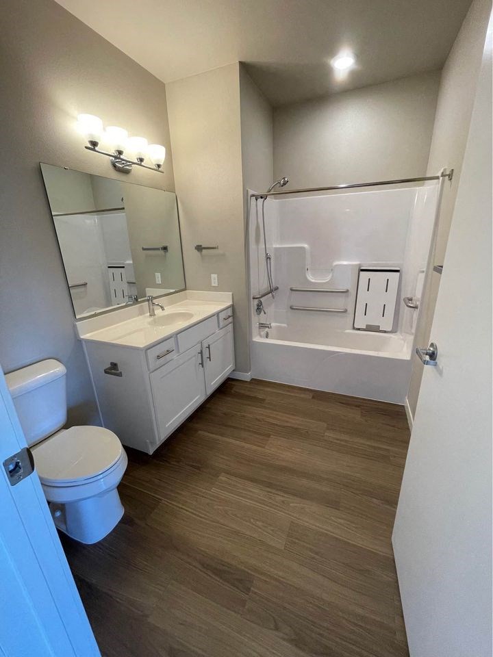 a bathroom with a sink toilet and a shower