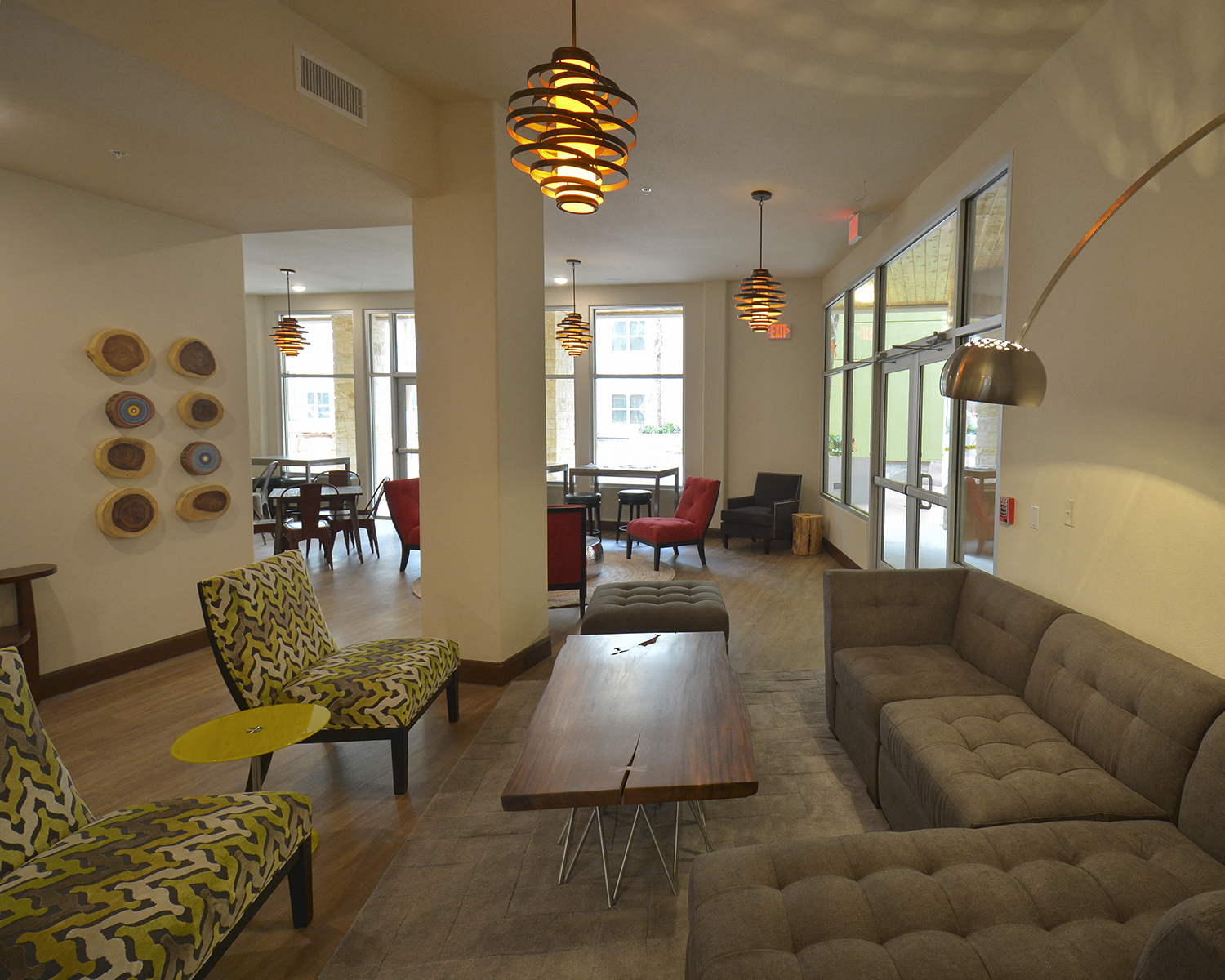 a living room with couches and chairs and a table