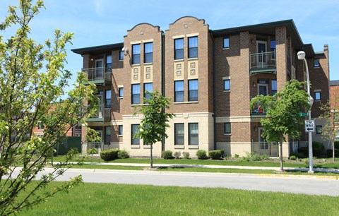 an apartment building on the corner of a street