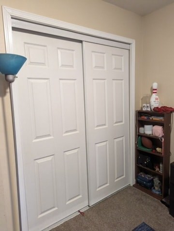 A white double door with a shelf to the right.