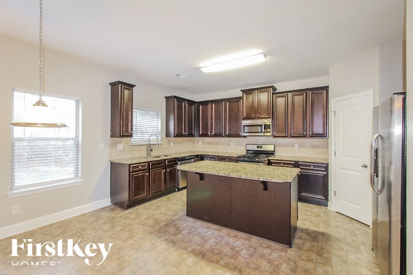 a kitchen with wooden cabinets and a counter top