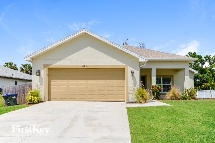 A two-car garage is attached to a house.