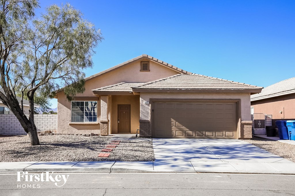 a house with a driveway and a garage door