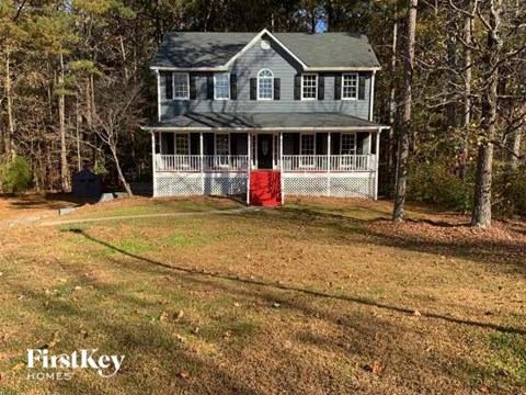 a house with a red door on the front of it