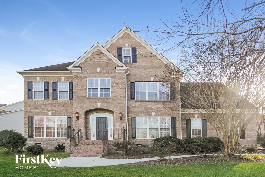 a brick house with a blue sky in the background