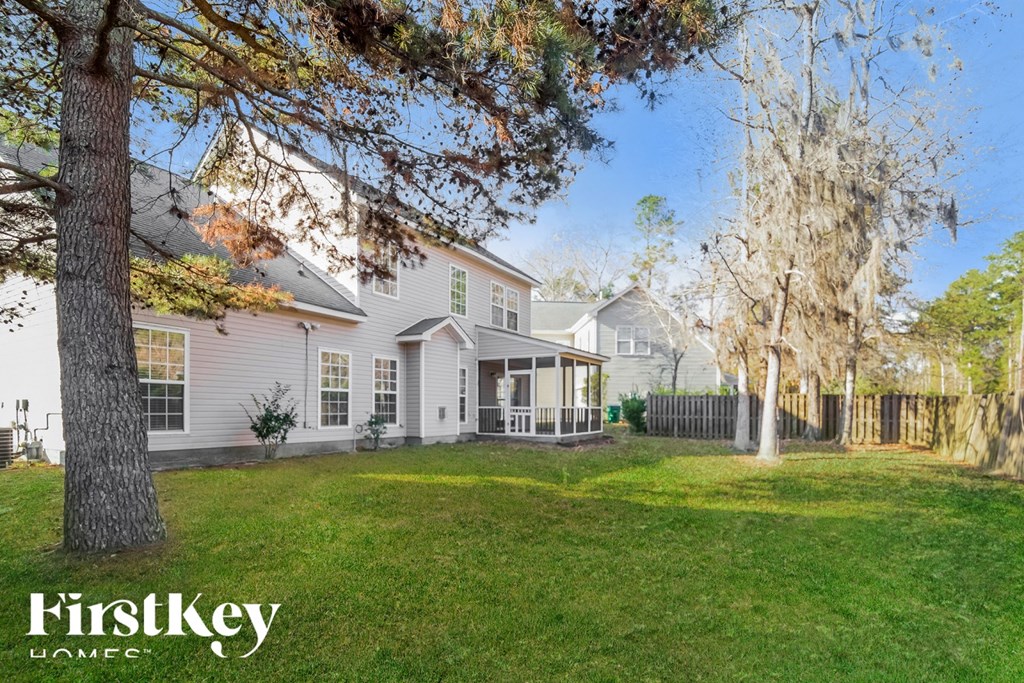 A house with a tree in front of it.