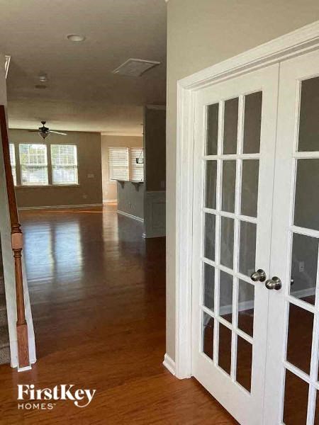 a living room and a kitchen with a door