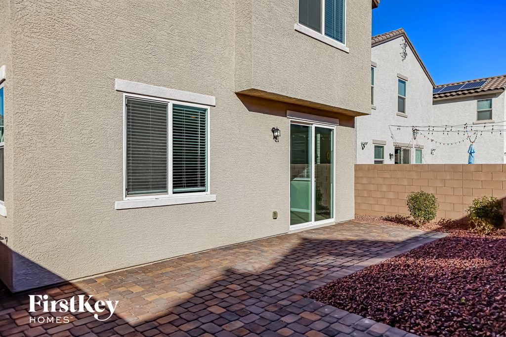 A house with a brick walkway in front of it.