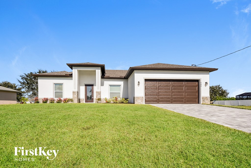 A house with a brown garage door is for sale by FirstKey Homes.