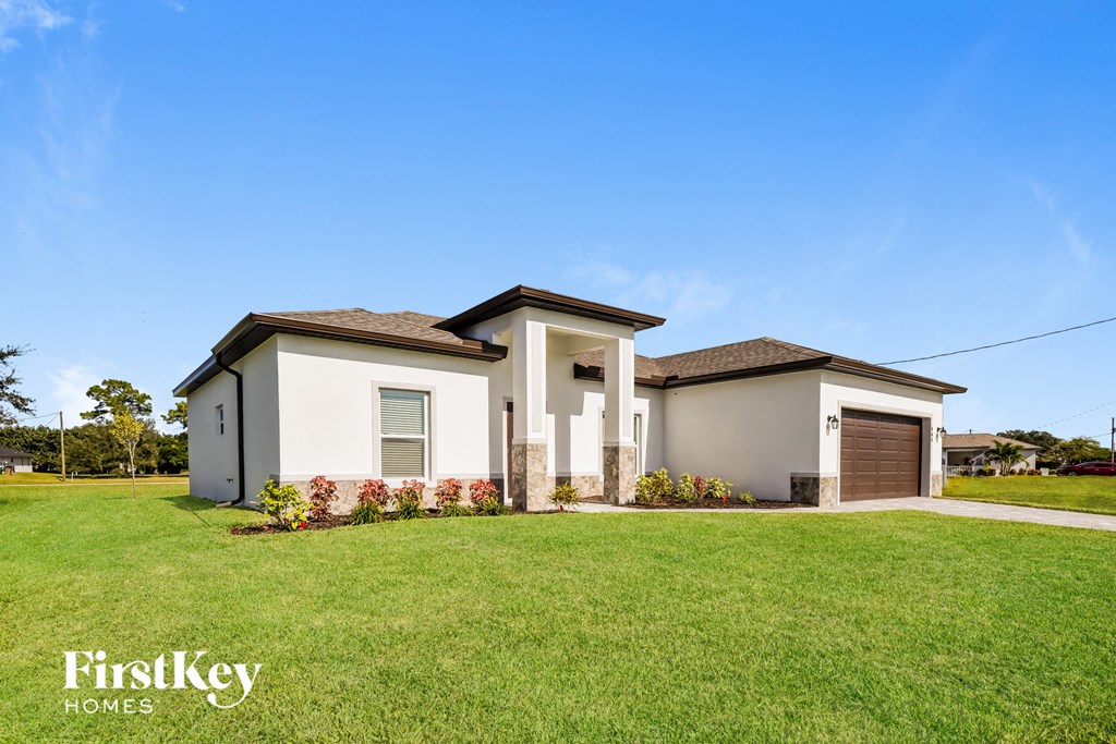 A two-story house with a garage is for sale by FirstKey Homes.
