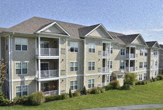 an image of an apartment building on a hill