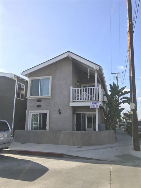 A house with a balcony is for sale.