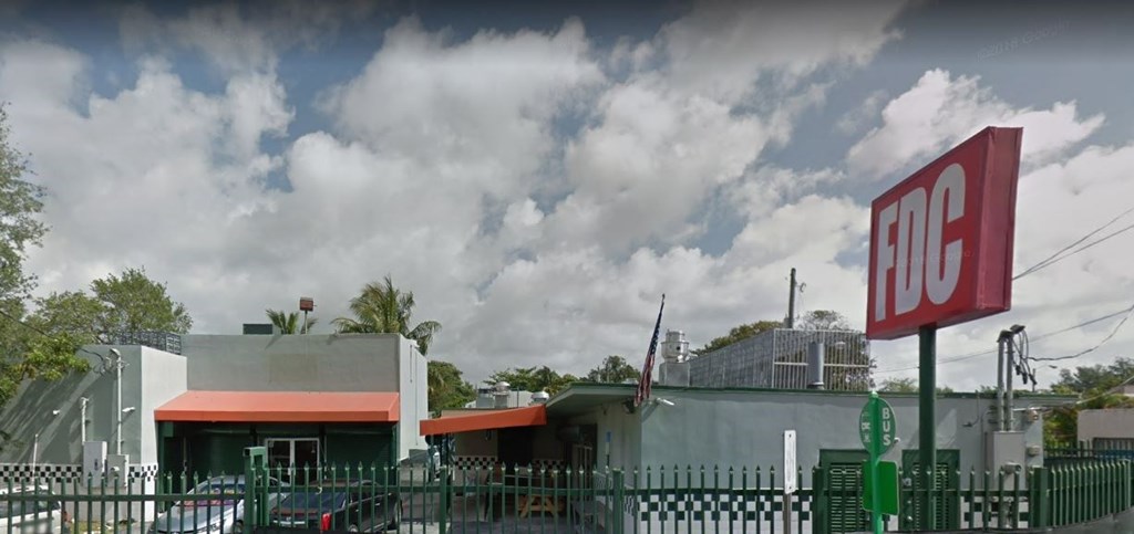 The FDC sign is red and white.