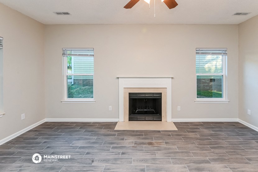 the living room of a house with a fireplace