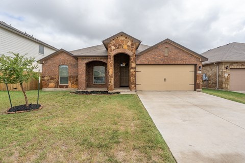 a house with a driveway and a garage door