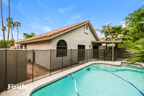 A house with a pool in the backyard.