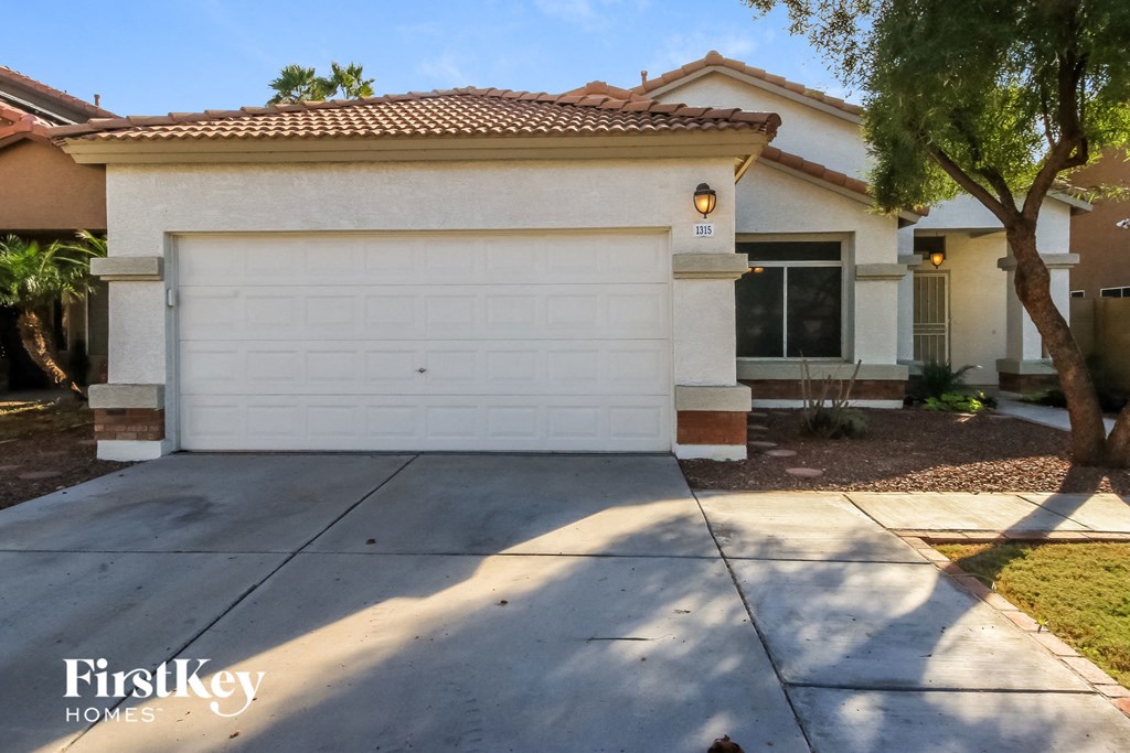 a white garage door in front of a house