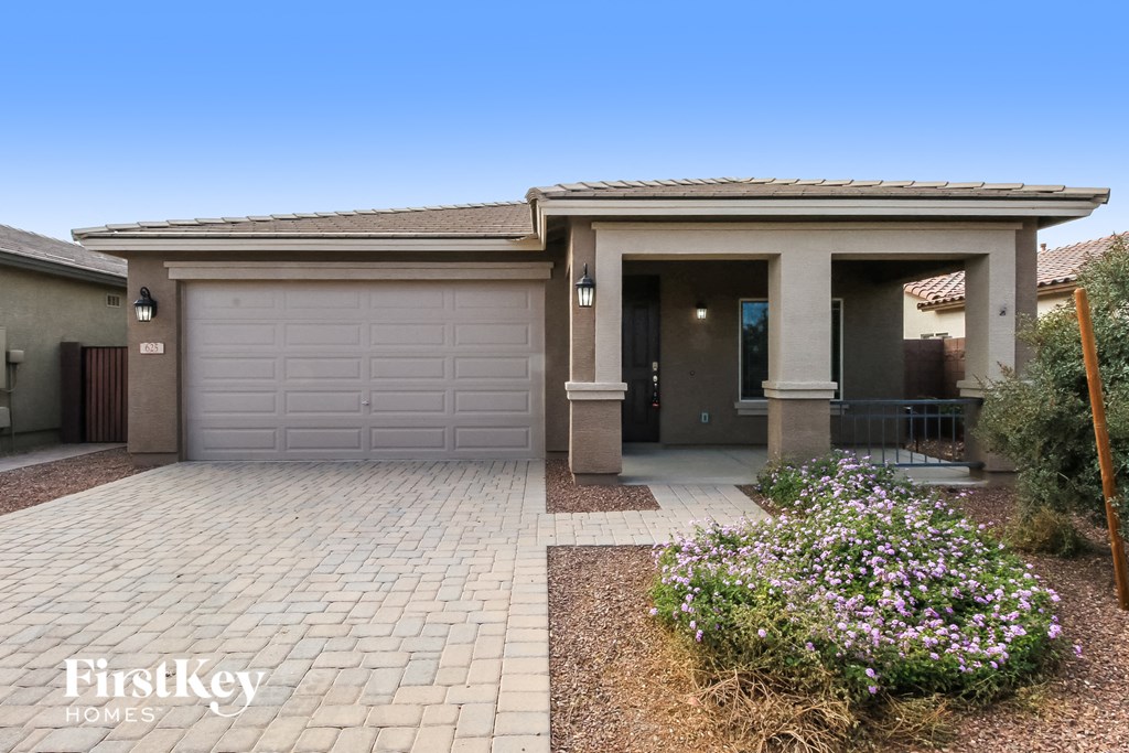 a house with a driveway and a garage door
