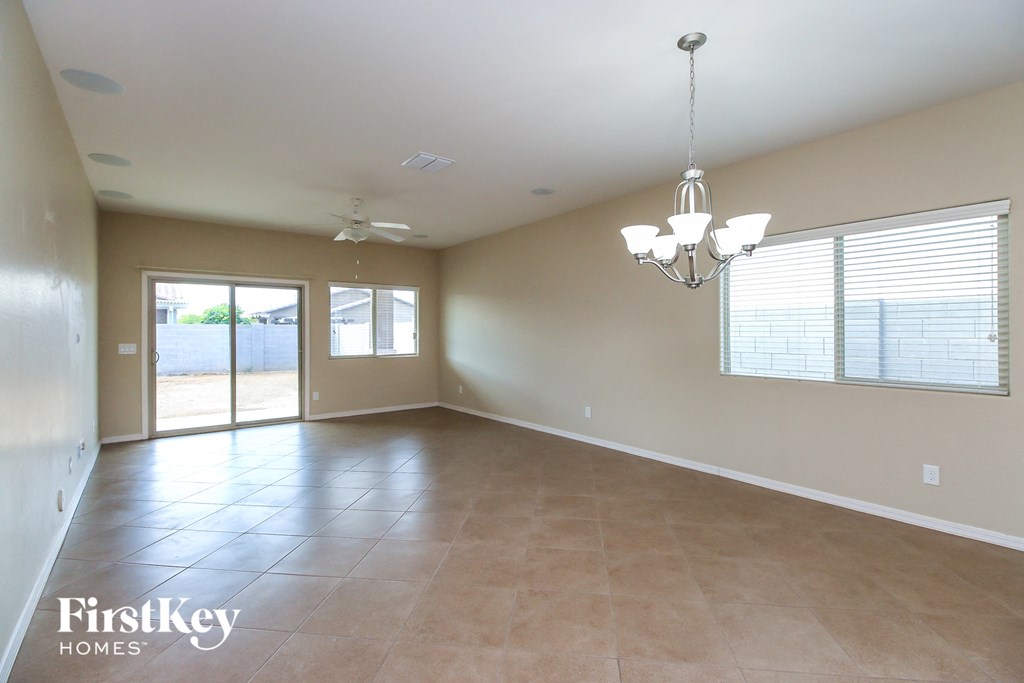 an empty living room with a door to the patio