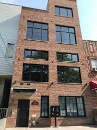 a tall brick building with lots of windows