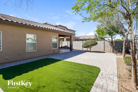 a house with a yard and a driveway and grass