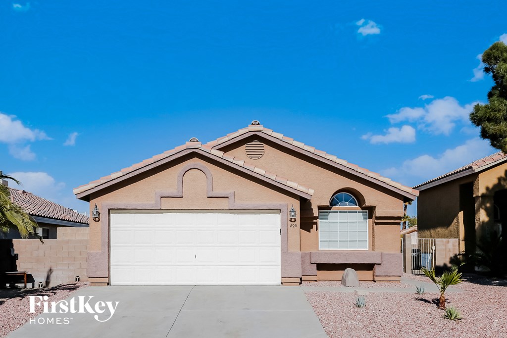 a house with a white garage door in front of it