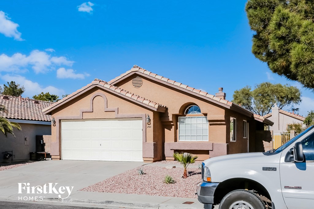 a house with a truck parked in front of it