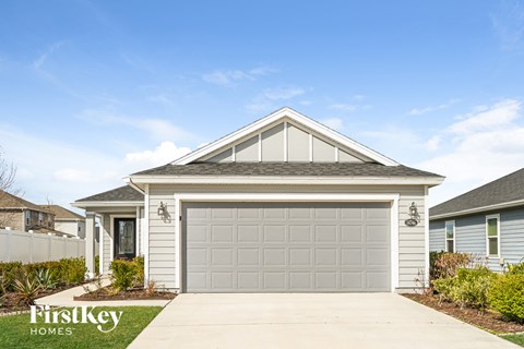 a white garage door in front of a house