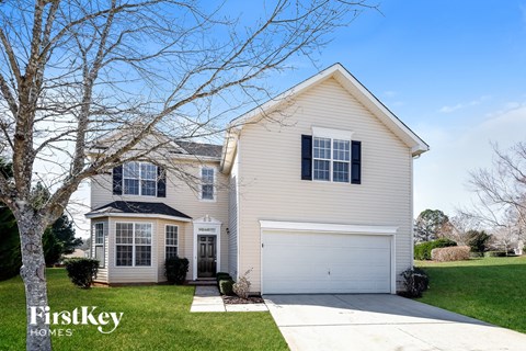 a home with a white house and a white garage door